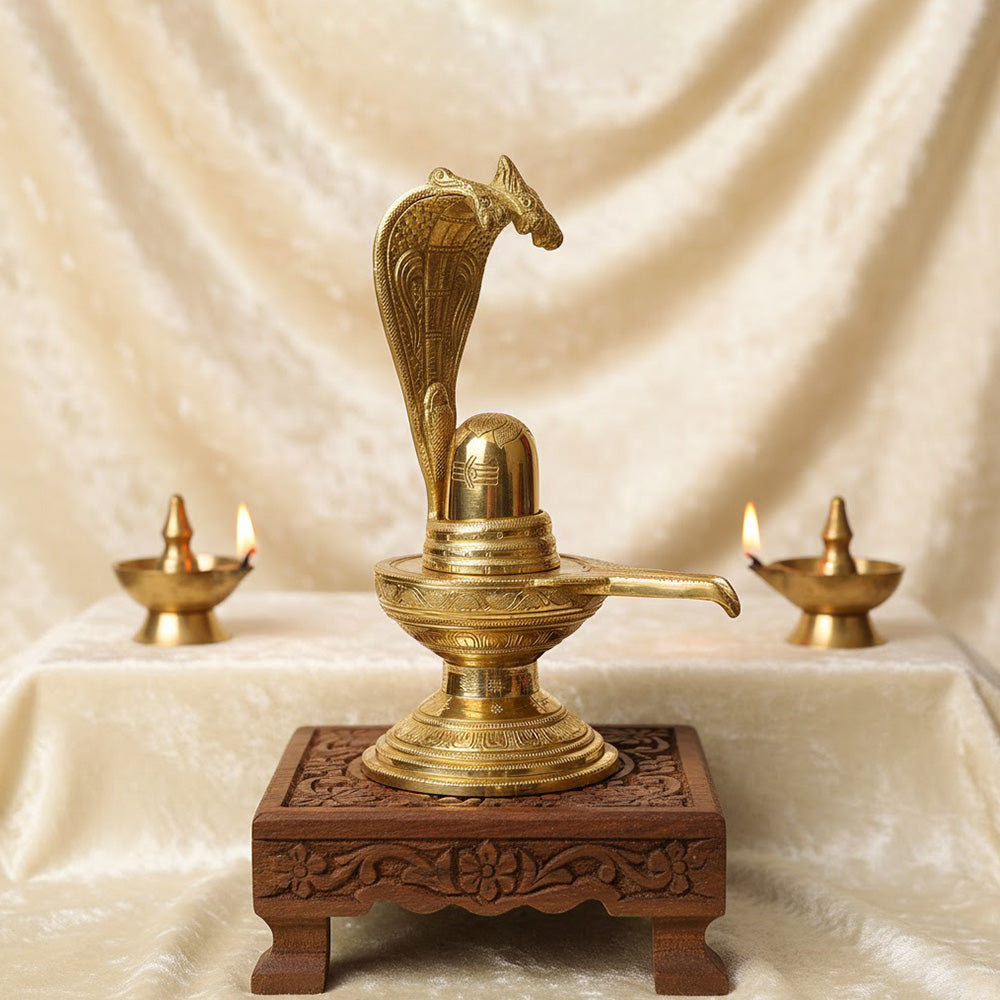 14.2-inch Brass Shivling with Nag Hood, intricately designed for divine worship and ideal for Shivratri rituals and spiritual décor. No.1 Brass Idol Store www.satvikstore.in