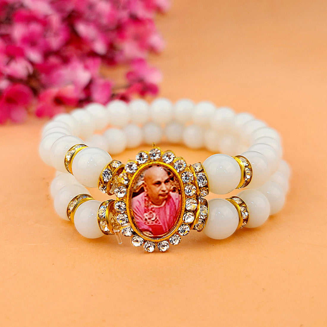 Off White Round Pearl Bracelet with Jai Guruji Swaroop