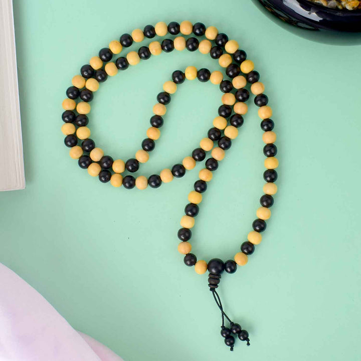 8mm Ebony & White Scented Mala – 108+1 bead meditation mala combining dark ebony and fragrant white sandalwood beads for spiritual balance and focus. India’s Largest Pooja Accessories Brand - www.satvikstore.in