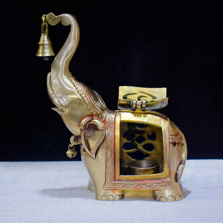 10.6 Inch Brass Elephant Tealight Holder with Bell, beautifully handcrafted with intricate detailing, perfect for enhancing home and pooja décor with a traditional and spiritual touch. No.1 Brass Idol Store www.satvikstore.in