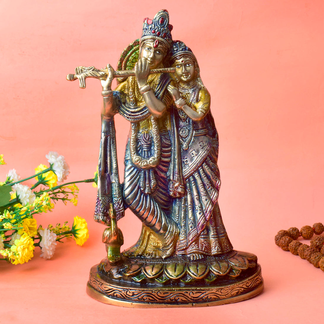 The 11.4 Inch Radha Krishna โ Divine Harmony in a Sacred Sculpture is a breathtaking masterpiece that captures the eternal and divine bond between Radha and Krishna. This beautifully detailed idol showcases the couple in a serene and harmonious pose, with Krishna playing his mesmerizing flute and Radha standing gracefully by his side.