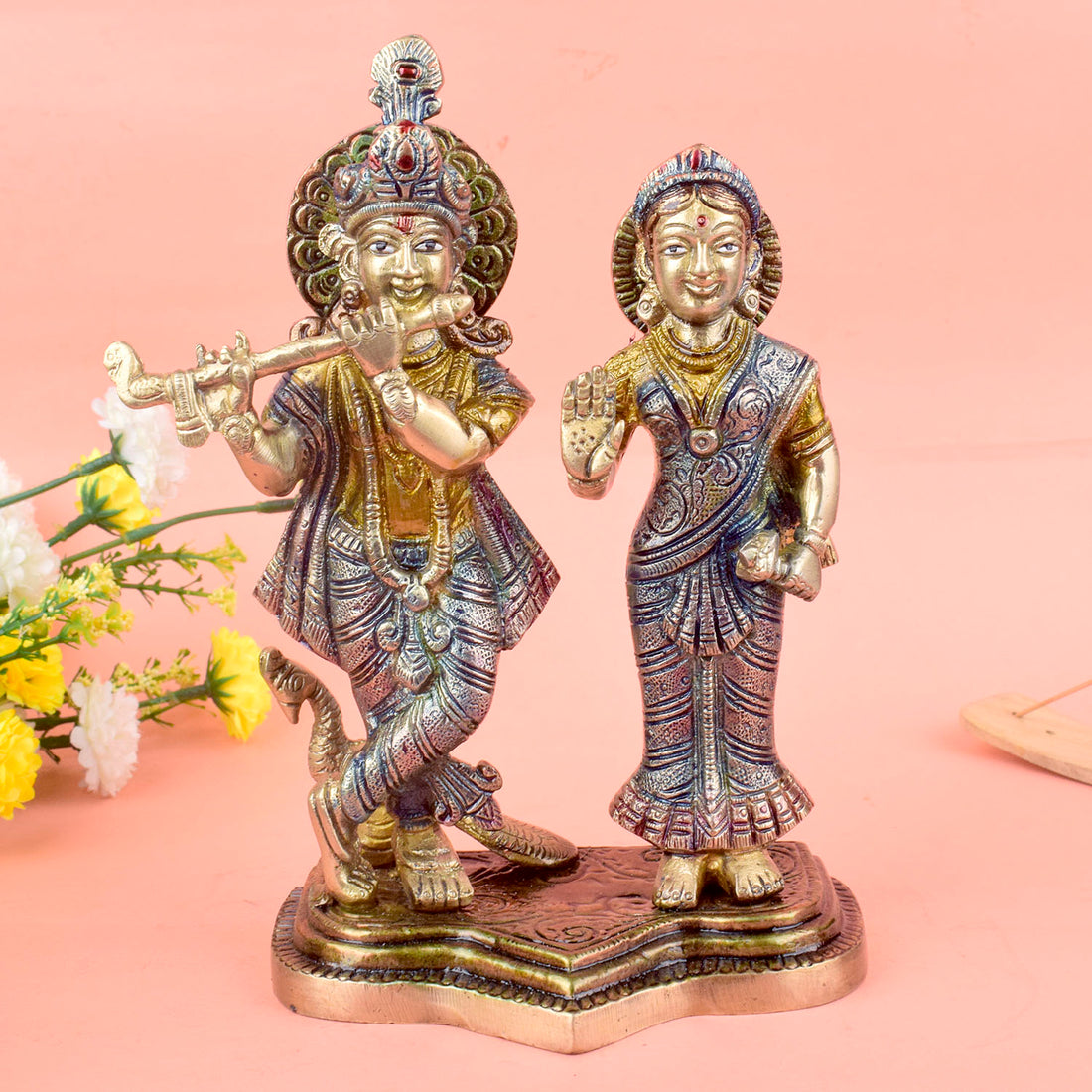 The 8 Inch Radha Krishna Idol โ A Symbol of True Devotion and Love is a magnificent representation of the eternal bond between Radha and Krishna, capturing the purity and depth of their divine love. This beautifully crafted idol depicts Krishna playing his flute, while Radha stands beside him, radiating grace, love, and devotion.