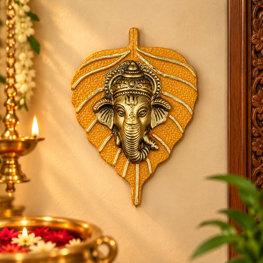1 Pc Lord Ganesh Face on Leaf Patta Wall Hanging Yellow
