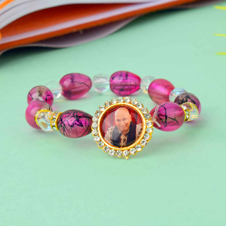 Guruji Swaroop Bracelet with coloured beads in clear, blue, green, and pink β ideal for daily wear and spiritual occasions. Indiaβs Largest Pooja Accessories Brand β www.satvikstore.in