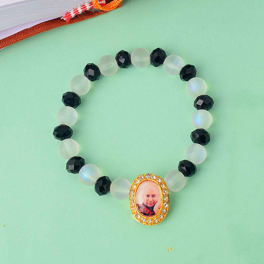 Guruji Swaroop Bracelet with elegant white and black beads – spiritual bracelet for pooja, gifting, satsangs, and daily wear. Satvikstore.in