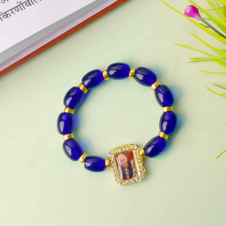 Guruji Swaroop Bracelet with radiant blue and golden beads β spiritual bracelet for pooja, gifting, satsangs, and daily wear. Satvikstore.in