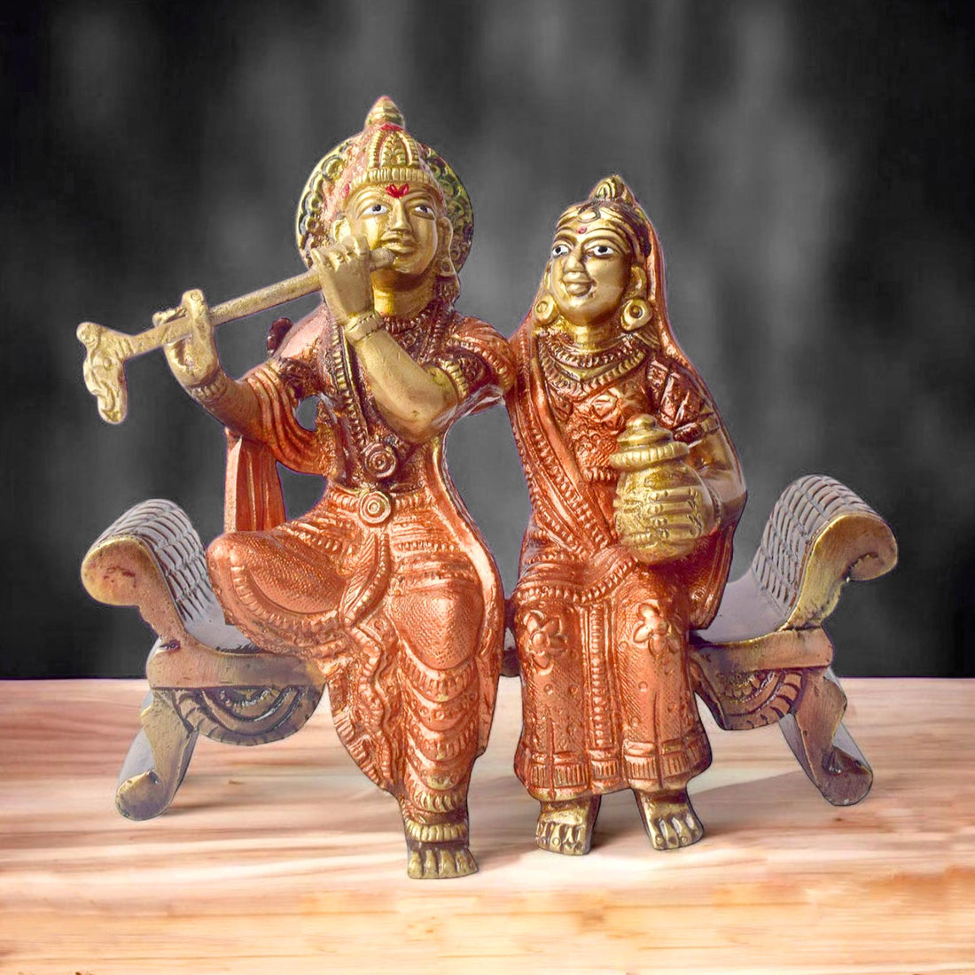 The 4.7 Inch Graceful Sitting Radha Krishna on Bench β A Spiritual Masterpiece is a beautifully crafted idol that captures the essence of divine love and serenity. This exquisite piece features Radha and Krishna seated gracefully on a bench, symbolizing their eternal bond and peaceful companionship. Krishna, with his flute, and Radha, with a serene expression, reflect the harmonious union of the divine couple.