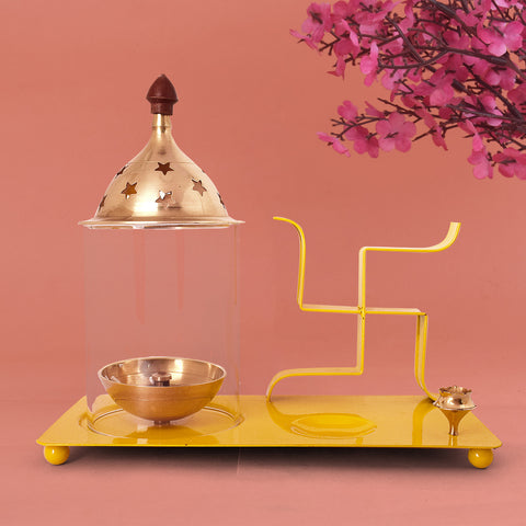 Yellow brass and metal Swastik chimney diya tray set featuring an integrated incense holder, ideal for daily puja rituals and auspicious spiritual decor. Indiaβs Largest Pooja Accessories Brand β www.satvikstore.in