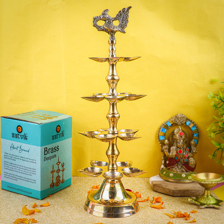 Brass 4 Step Panchmukhi Peacock Kerala Diya β Handcrafted brass diya with a four-step structure, Panchmukhi (five-faced) design, and peacock motif, perfect for pooja rituals, temple lighting, and traditional dΓ©cor. Indiaβs Largest Pooja Accessories Brand β www.satvikstore.in