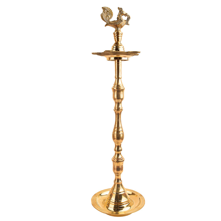 23 Inch Brass Peacock Kerala Diya – Handcrafted brass diya featuring a detailed peacock motif, ideal for grand pooja rituals, temple lighting, and traditional décor. India’s Largest Pooja Accessories Brand – www.satvikstore.in