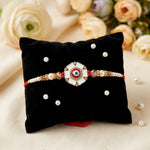 Elegance White Meenakari and Red Evil Eye Designer Rakhi