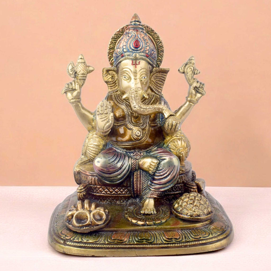 The "9.1 Inch Sacred Ganesh Idol" is a beautifully crafted statue of Lord Ganesha, symbolizing wisdom, success, and the removal of obstacles. Standing at 9.1 inches tall, it features intricate detailing and traditional attributes like the axe, lotus, and modak.