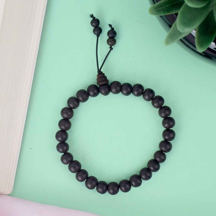 8mm Ebony Bracelet with Matt Finish – smooth black wooden beads with a non-reflective surface, offering a subtle and elegant spiritual accessory. India’s Largest Pooja Accessories Brand - www.satvikstore.in 

