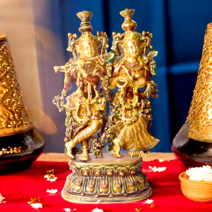  This Stunning Radha Krishna Brass Idol beautifully captures the divine love and grace of Radha and Krishna. Crafted from high-quality brass with intricate detailing, it exudes elegance and spiritual charm. 
