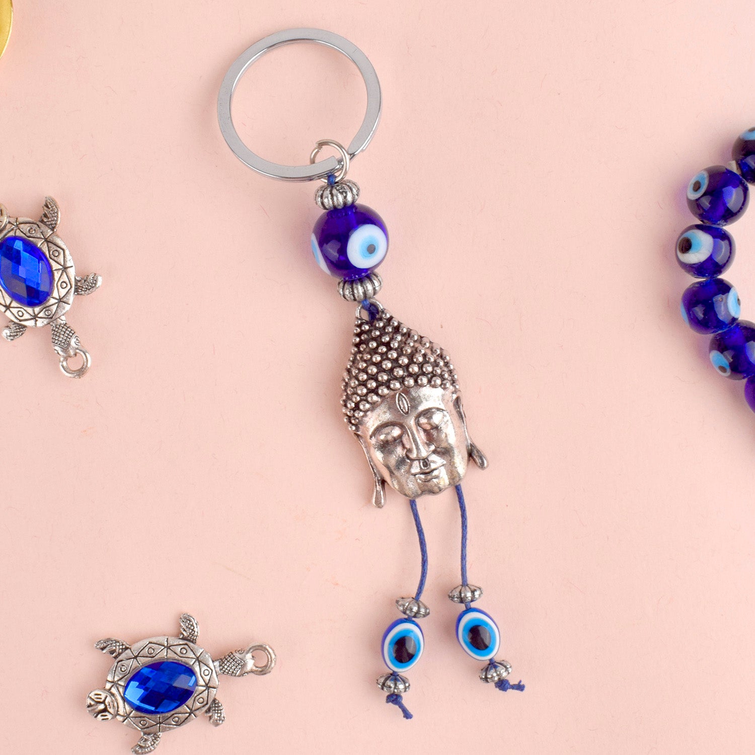 Alluring Silver Plated Buddha Keychain with Evil Eye