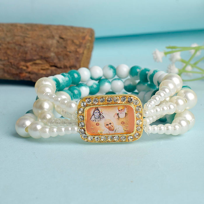 Bluish Green & White Marble Four Layer Guruji Swaroop Bracelet featuring tranquil bluish green beads and marble effect white beads with Jai Guruji Swaroop – perfect for spiritual wear, festive gifting, and daily devotion. India’s Largest Pooja Accessories Brand – www.satvikstore.in