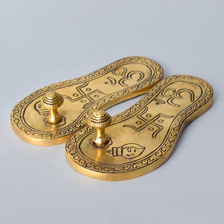 Divine Brass Charan Paduka (Khadau) with traditional design, symbolizing sacred footprints – perfect for temple rituals, home mandir worship, and spiritual offerings. No.1 Brass Idol Store www.satvikstore.in 