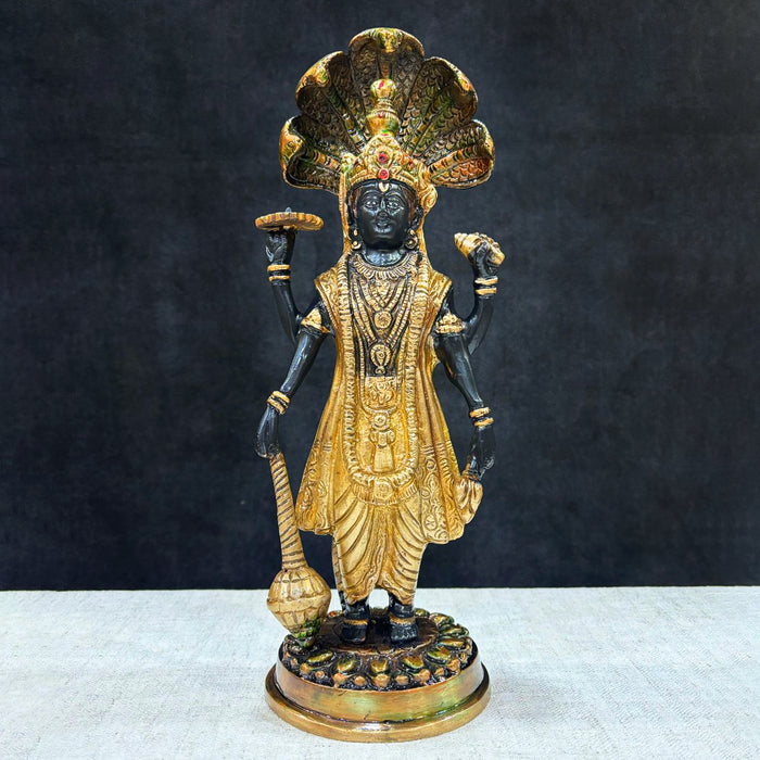  This elegant brass statue of Lord Vishnu seated on the mighty Seshnag is a powerful symbol of divine protection, balance, and cosmic order. The intricate craftsmanship beautifully depicts Lord Vishnu in his serene and majestic form, with the multi-headed Seshnag providing a protective canopy.  India's Largest Puja Accessories Brand - Satvik No. 1 Brass Idol Collection 