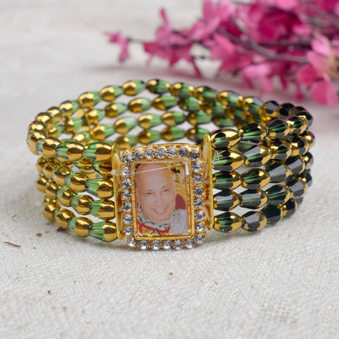 Jai Guruji Swaroop Pearl Bracelet adorned with Crystal Green Beads.