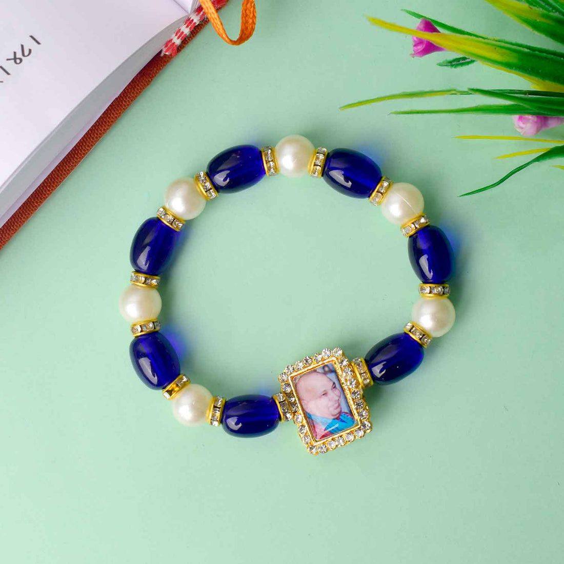 Elegant Guruji Swaroop Bracelet made with blue and white pearls for divine connection and spiritual elegance. India’s Largest Pooja Accessories Brand – www.satvikstore.in
