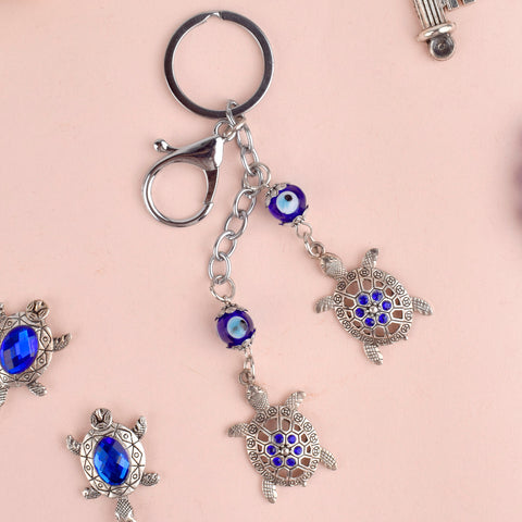Evil Eye 2 Tier Turtle Metal Keychain – A Feng Shui good luck charm symbolizing longevity, stability, and protection. India’s Largest Pooja Accessories Brand – www.satvikstore.in