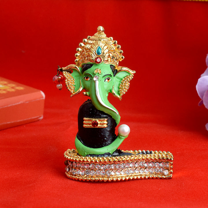 Ganesha with Shivalingam statue, beautifully crafted in fine detail, depicting Lord Ganesha sitting beside the Shivalingam, symbolizing harmony between Lord Shiva and Lord Ganesha, ideal for worship, spiritual decor, and blessings.India’s Largest Pooja Accessories Brand – www.satvikstore.in 