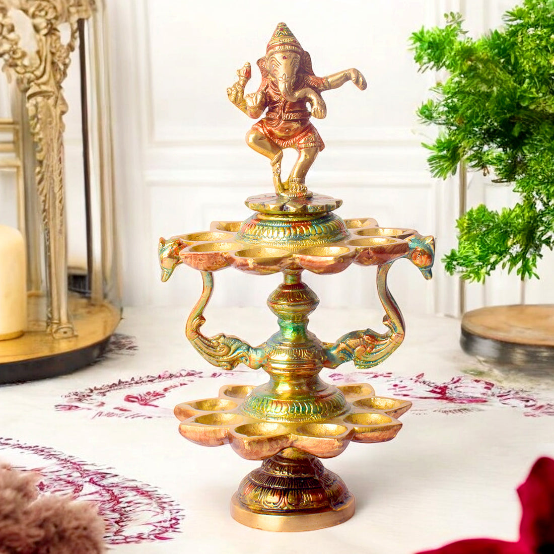 Handcrafted brass 21-wick Ganesha Diya with 2-step aarti design, featuring a majestic Lord Ganesha idol and multiple flames for grand pooja ceremonies. India’s Largest Pooja Accessories Brand – www.satvikstore.in