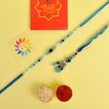 Designer Couple Rakhi Set for Bhaiya and Bhabhi with Roli Chawal and Ram Sita Stickers – Raksha Bandhan Gift Combo. India’s Largest Brass Idols Brand - www.satvikstore.in