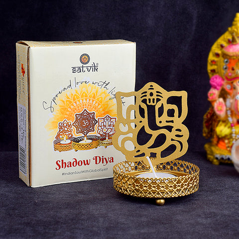 Lord Ganesha Shadow Diya handcrafted in metal, designed to project a divine shadow of Lord Ganesha when lit, ideal for Diwali, pooja rituals, and spiritual home décor. India’s Largest Pooja Accessories Brand – www.satvikstore.in