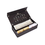 A box of Mysuru to the World incense with a variety of incense sticks and an elephant-shaped ash catcher, all displayed in an elegant black packaging with gold accents.