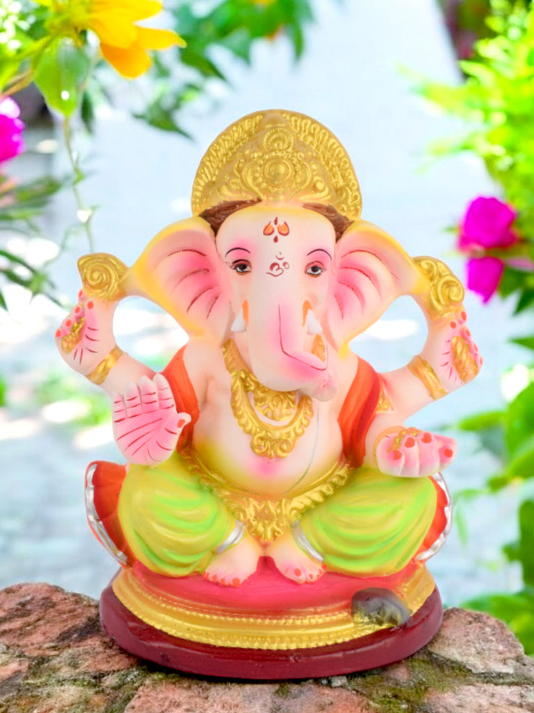 8.8-inch Nandana eco-friendly Ganesha idol seated gracefully in Padmasana, crafted from shadu mati and adorned with vibrant festive colors. India’s Largest Pooja Accessories Brand – www.satvikstore.in