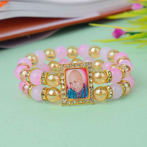 Radiant Guruji Swaroop Bracelet with golden and assorted colored beads – handcrafted spiritual bracelet for gifting and daily wear – www.satvikstore.in