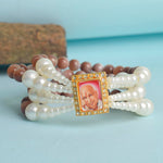 Wine & White Pearl Four Layer Guruji Swaroop Bracelet featuring luxurious wine-colored beads and luminous white pearls with Jai Guruji Swaroop – perfect for spiritual wear, festive gifting, and daily devotion. India’s Largest Pooja Accessories Brand – www.satvikstore.in