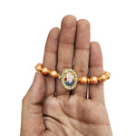 Orange Round Pearl Bracelet with Jai Guruji Swaroop