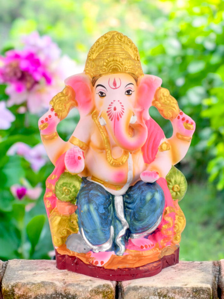 9.6-inch eco-friendly Ganesh idol seated royally on a shinghasan, handcrafted from natural clay and perfect for traditional festive decor. India’s Largest Pooja Accessories Brand – www.satvikstore.in