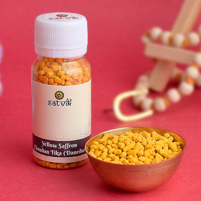 Yellow Chandan Tika (Saffron Chandan Tilak) Danedar for forehead application during puja, meditation, and spiritual rituals – India’s Largest Pooja Accessories Brand – www.satvikstore.in