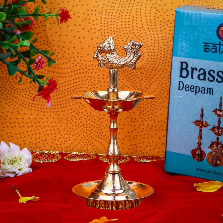 5.25 Inch Brass Peacock Kerala Diya – Handcrafted brass diya featuring a peacock motif, perfect for pooja rituals, temple lighting, and traditional décor. India’s Largest Pooja Accessories Brand – www.satvikstore.in
