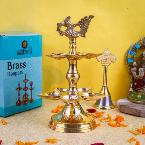 Brass 2 Step Panchmukhi Peacock Kerala Diya – Handcrafted brass diya featuring a two-step structure, Panchmukhi (five-faced) design, and peacock motif, perfect for pooja rituals, temple lighting, and traditional décor. India’s Largest Pooja Accessories Brand – www.satvikstore.in