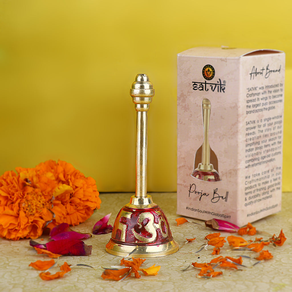Om Swastik Brass Puja Bell in red finish, featuring sacred symbols and a traditional design for spiritual rituals and aarti ceremonies. India’s Largest Pooja Accessories Brand – www.satvikstore.in