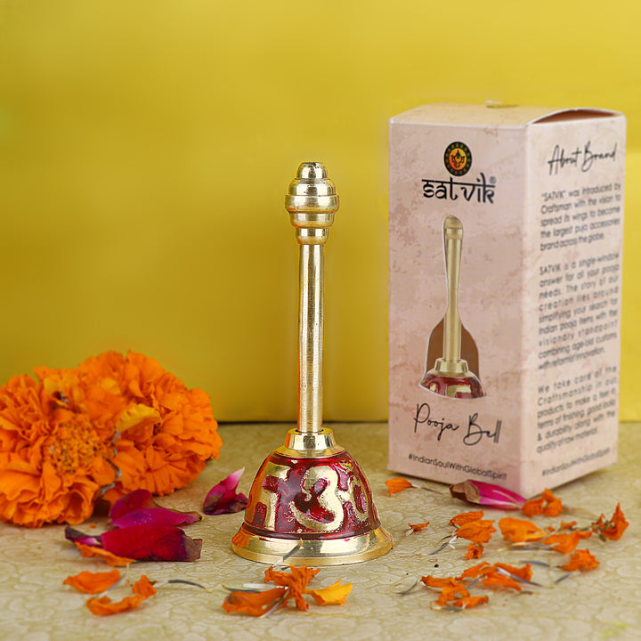 Om Swastik Brass Puja Bell in red finish, featuring sacred symbols and a traditional design for spiritual rituals and aarti ceremonies. India’s Largest Pooja Accessories Brand – www.satvikstore.in